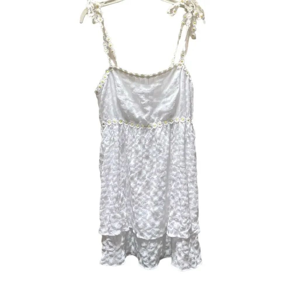 Crystal Doll size L tiered daisy trimmed mini dress.